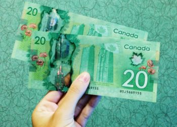 كيفية توزيع مساعدة الـ 500 دولار ومن هو المؤهل لتلقيها